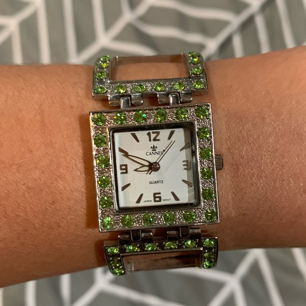 Women’s silver tone watch with green rhinestones